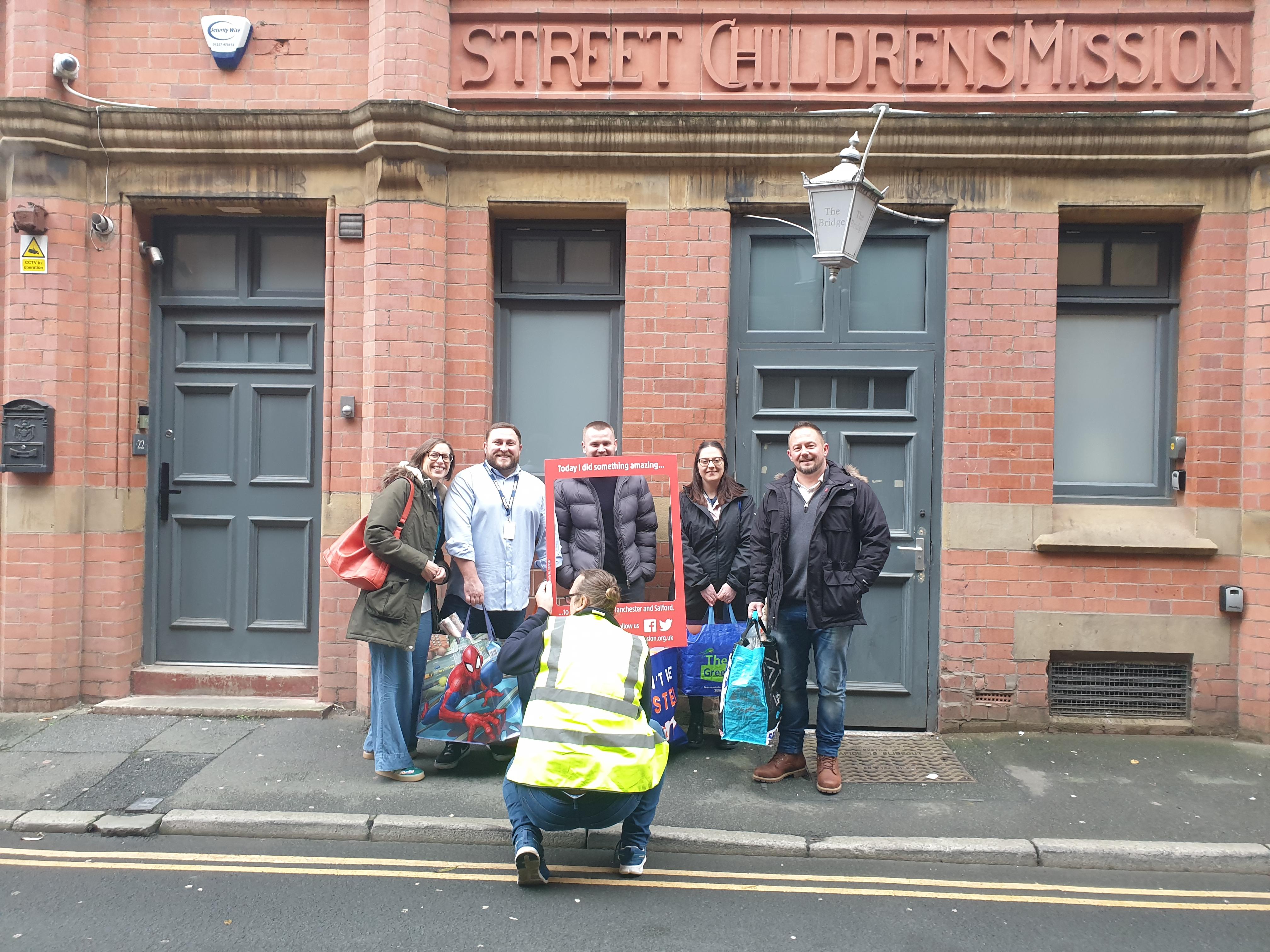 Eleven team donating toys to Wood Street Mission Eleven team donating toys to Wood Street Mission